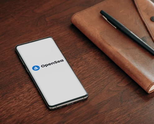 a cell phone and a pen on a table
