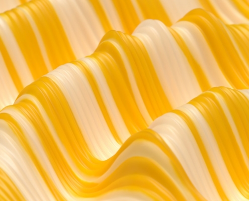 A close up of a wavy yellow and white material