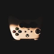a close up of a video game controller in the dark