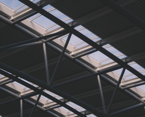 a close up of a metal structure with sky in the background