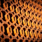 A close up view of a wall made of honeycombs