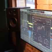 a computer monitor sitting next to a brick wall