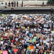 a large group of people holding up signs