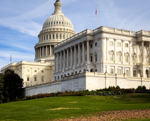 a large white building with a flag on top of it