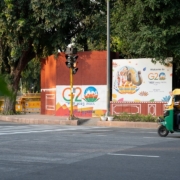 a man driving a cart down a street