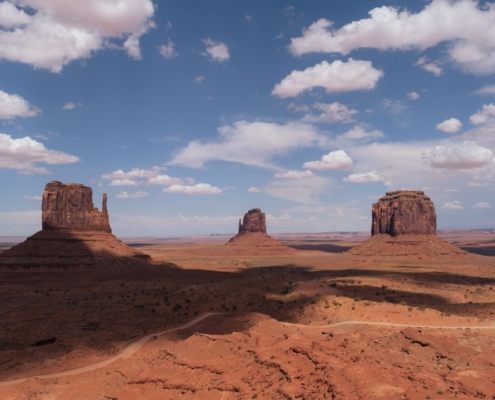 a scenic view of the desert with a few rocks in the foreground