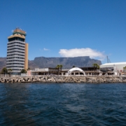 a tall building sitting next to a body of water