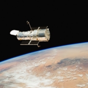 an image of a satellite above the earth