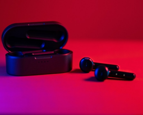 black and blue bluetooth earbuds
