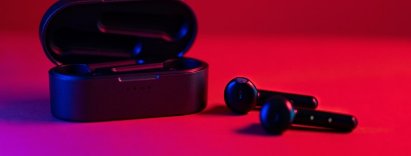 black and blue bluetooth earbuds