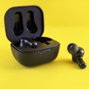 Black earbuds and their charging case.