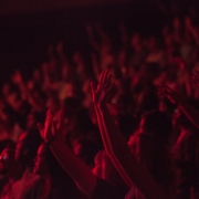 crowd lifting their hands watching concert