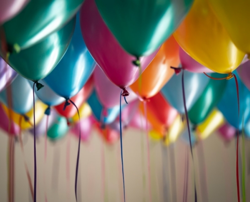 selective focus photography of assorted-color balloons
