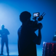 silhouette of man holding camera