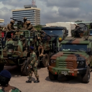 Soldiers with military vehicles on a street