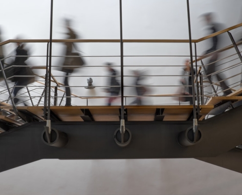 time lapse photography of people passing on bridge