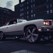 white car parked near building during daytime