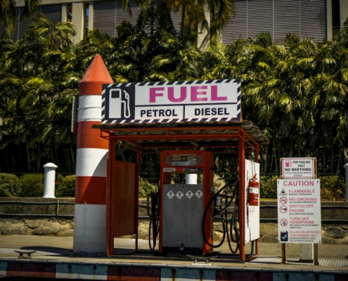 a gas station with a rocket on top of it