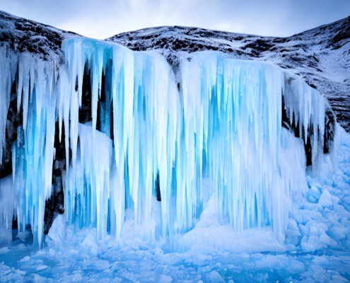 a group of icebergs in the water