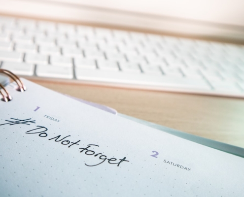 a notepad with a notepad next to a keyboard