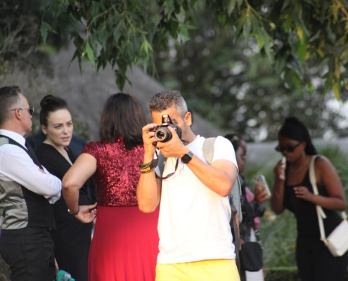 a person taking a picture of a group of people