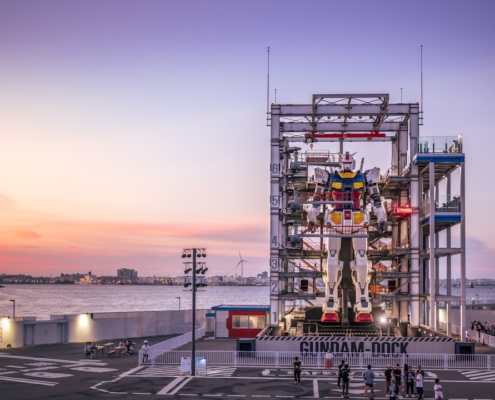 A very tall structure sitting next to a body of water