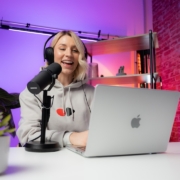 a woman sitting in front of a laptop computer