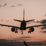 black airplane in mid air during daytime