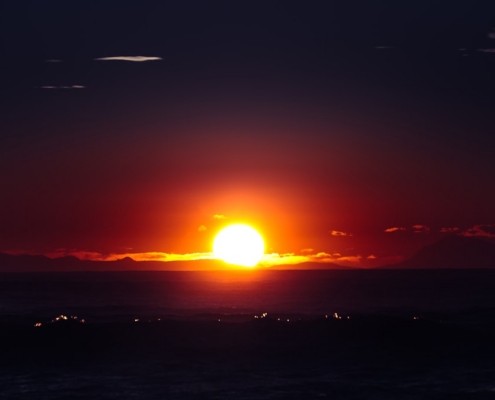 body of water during sunset