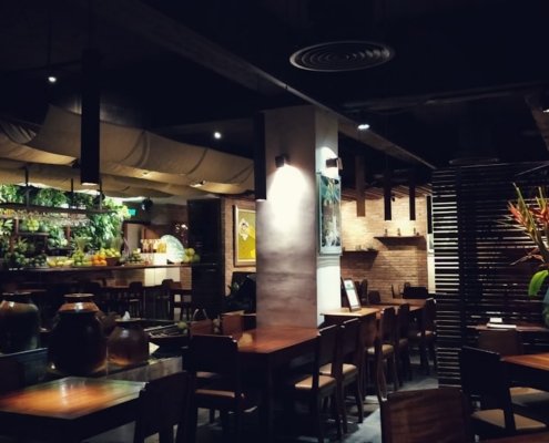 brown wooden chairs and tables on restaurant