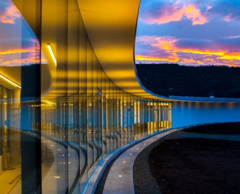 clear glass wall building under blue sky with clouds
