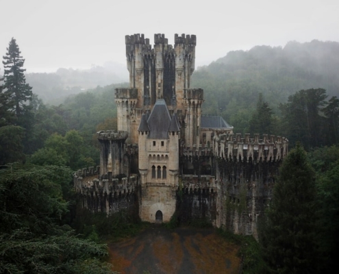 grey concrete castle on top of hill
