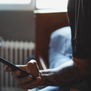 man holding black phone