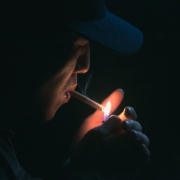 man lighting his cigarette