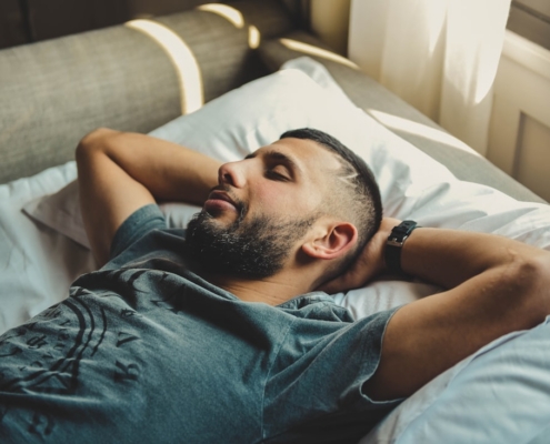 man lying on bed