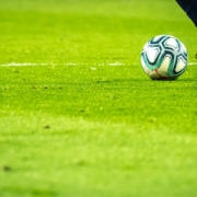 man playing soccer game on field
