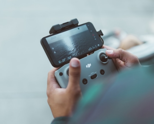 person holding red and black nintendo switch