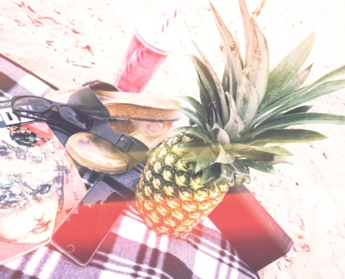 pineapple beside phone and speaker