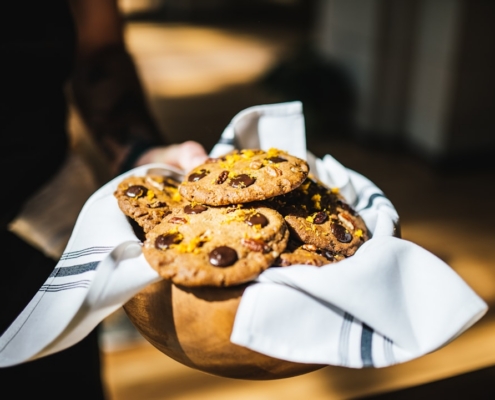 shallow focus photography of cookies on bowl with towel