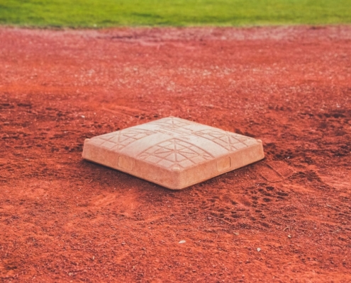 square brown concrete baseball base on soil