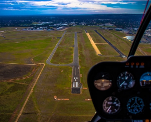 vehicle mirror viewing aerial view of land