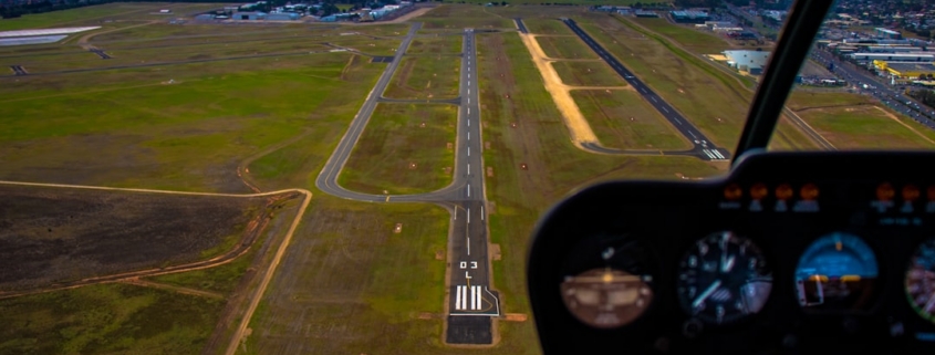 vehicle mirror viewing aerial view of land