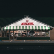 white and green food store during night time