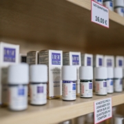 white plastic bottles on brown wooden shelf