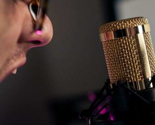 woman in black shirt holding microphone