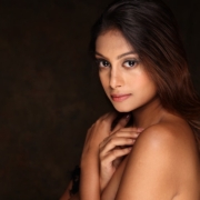 a beautiful young woman posing for a picture