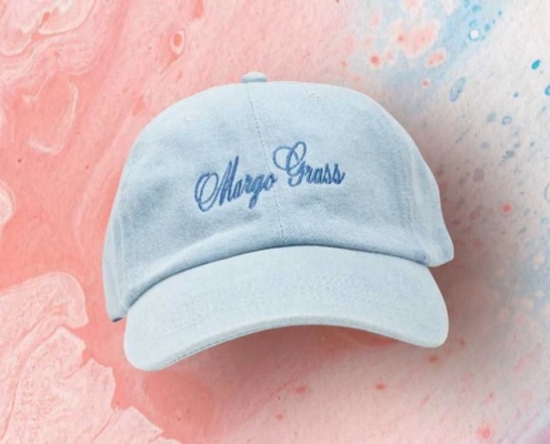 a blue cap with the word cheap brass embroidered on it