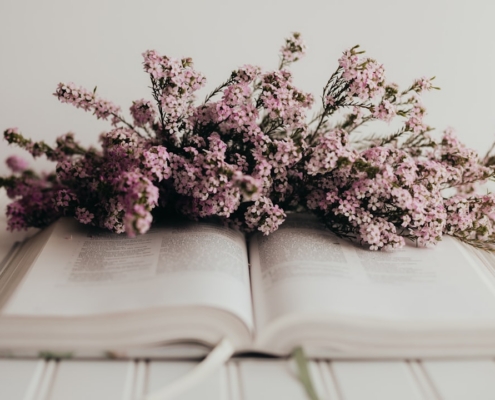 a book with a bunch of flowers on top of it