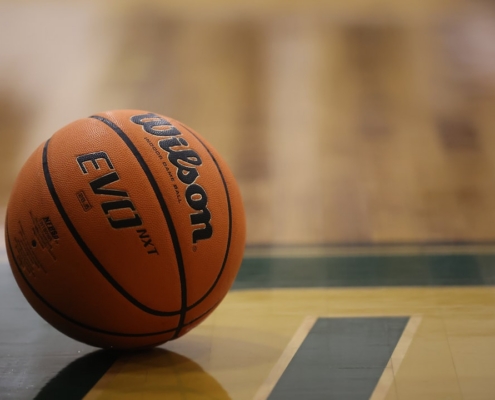 a close up of a basketball on a basketball court