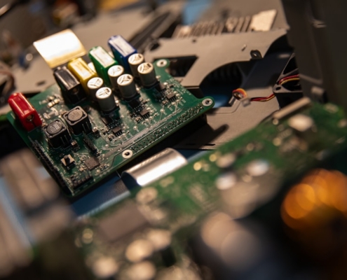A close up of a computer motherboard with many wires